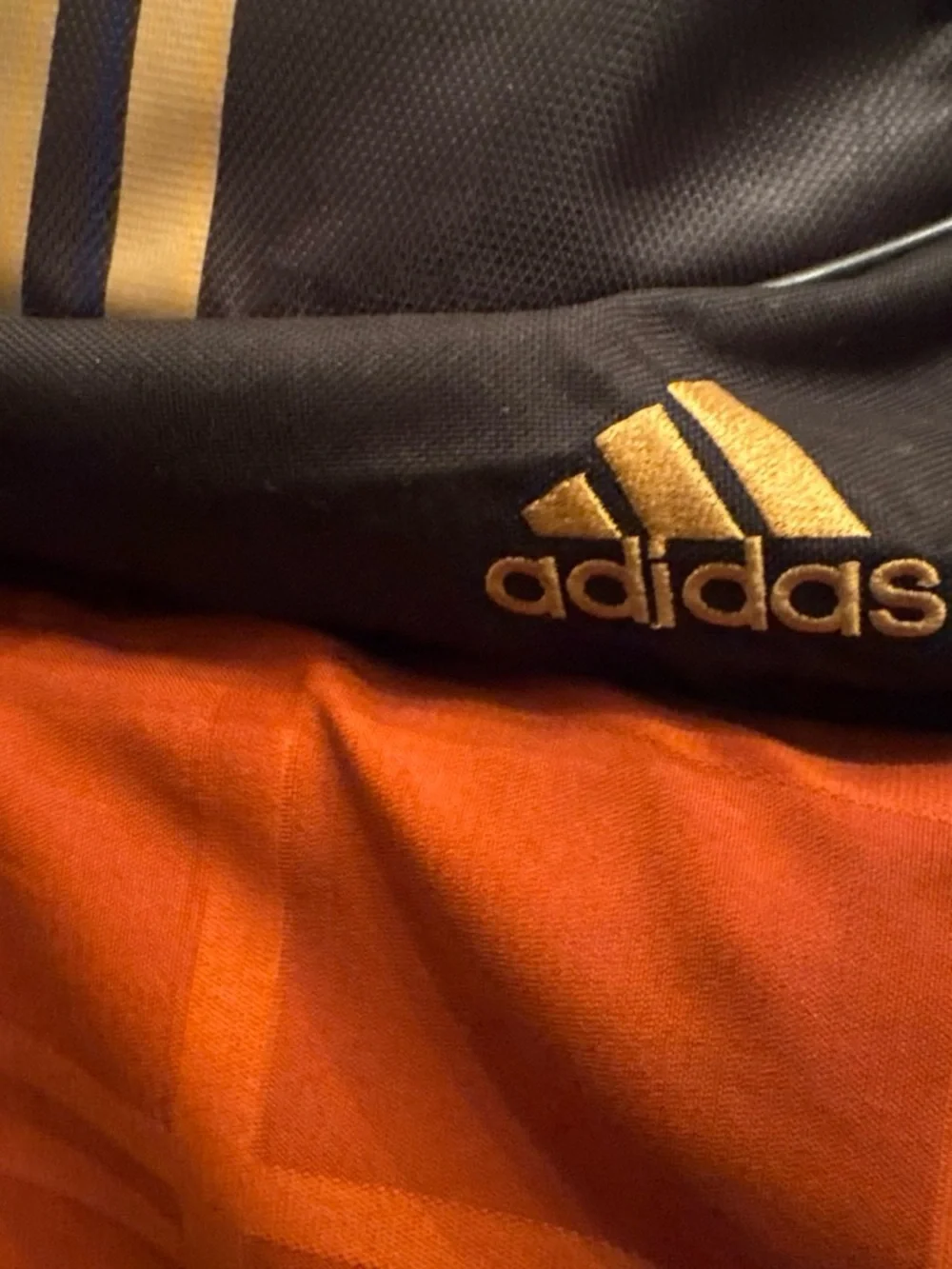 adidas Black Backpack with Gold Stripe Accents